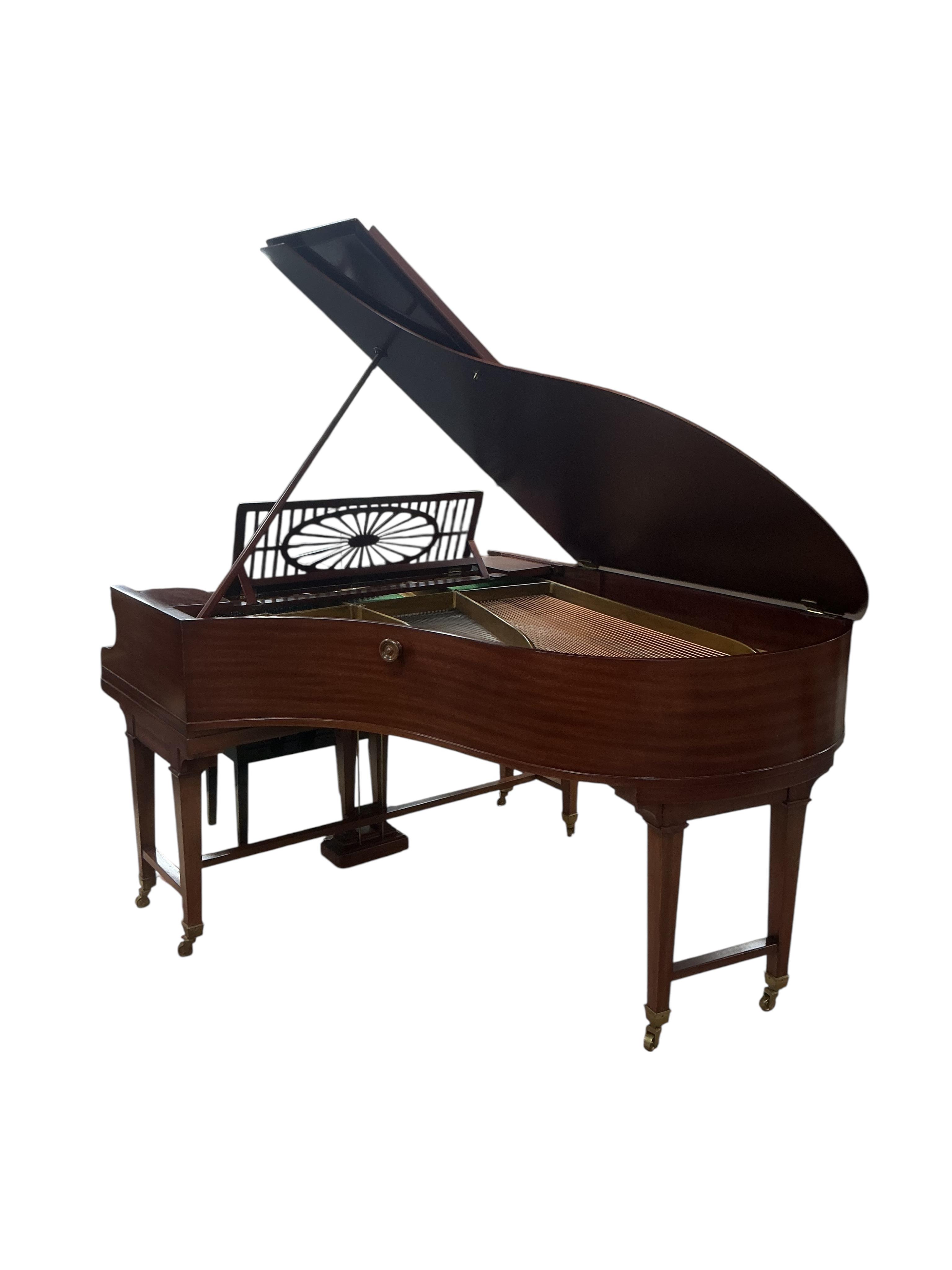 A Bechstein mahogany cased boudoir grand piano, model A, number 96003 (c.1910). Recently restrung, new felt to hammers and case re-polished, together with an adjustable ebonised piano stool. Length 182cm, depth 144cm.